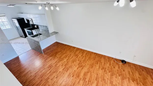 a front view of a house with swimming pool having outdoor seating