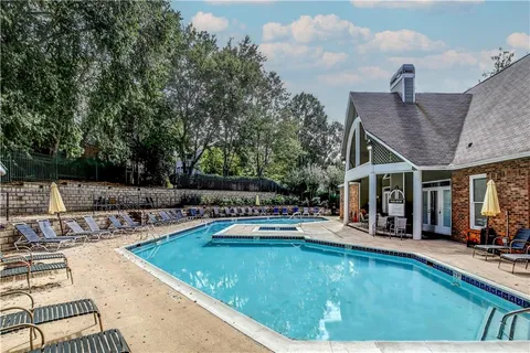 a view of a swimming pool with a lounge chair