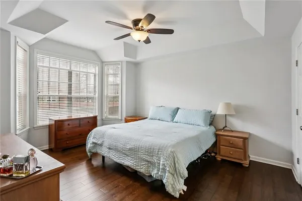 a bedroom with a bed and a couch