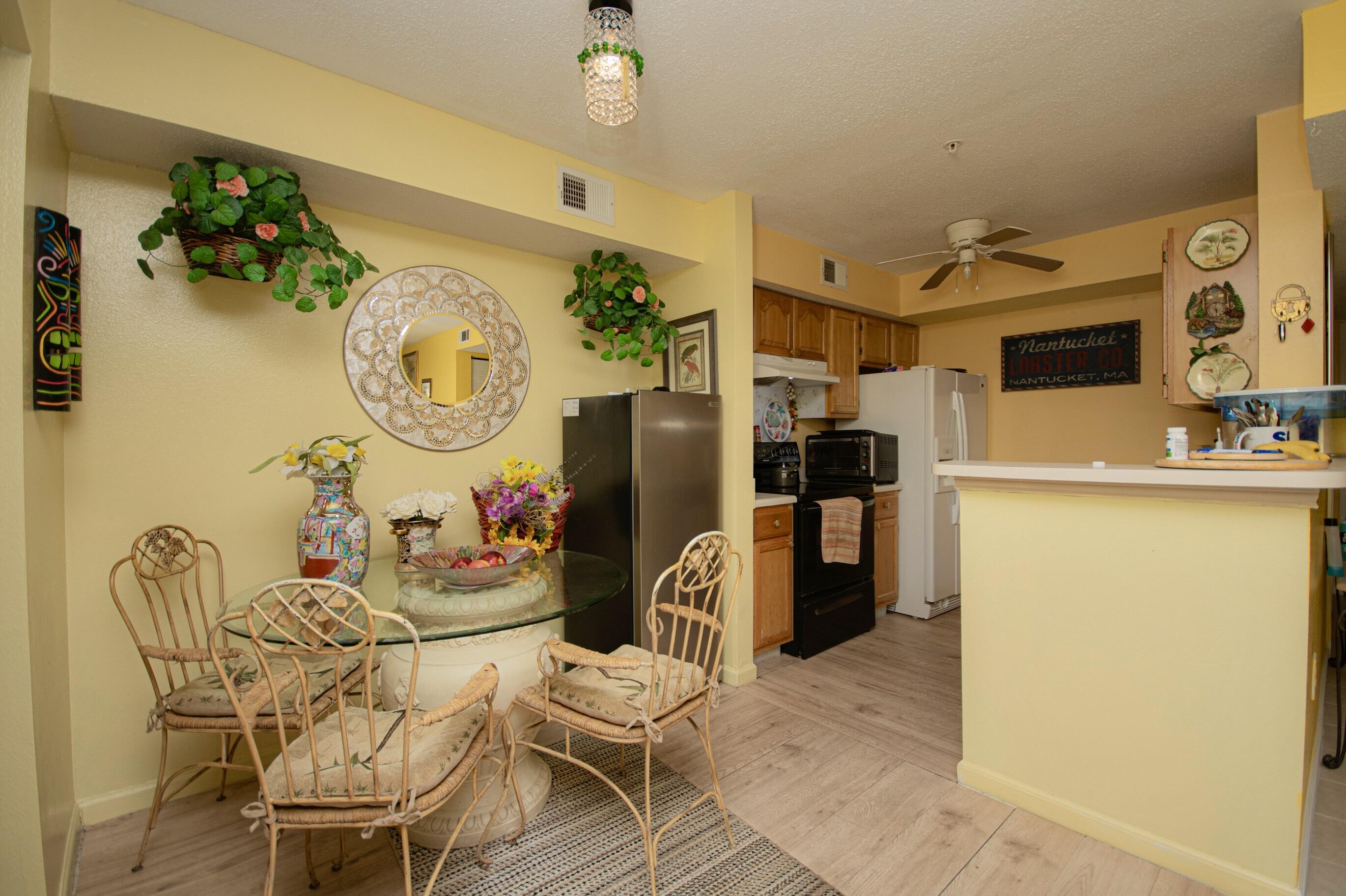 4080 Dancing Cloud Court, Unit 218 Destin, FL 32541 - Photo 11 of 28 a living room with patio furniture and a window