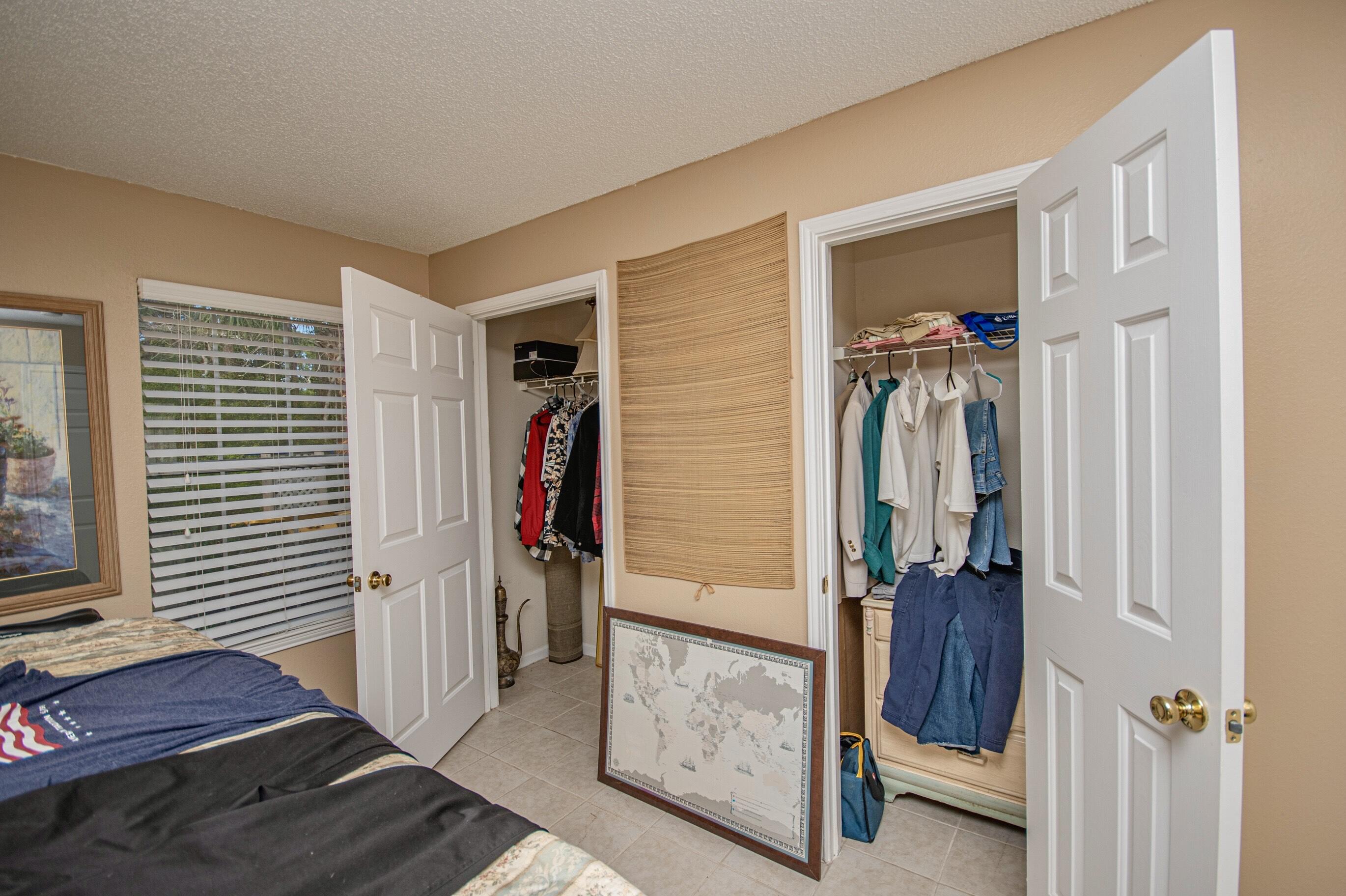 4080 Dancing Cloud Court, Unit 218 Destin, FL 32541 - Photo 15 of 28 a view of entryway with bedroom and wooden floor