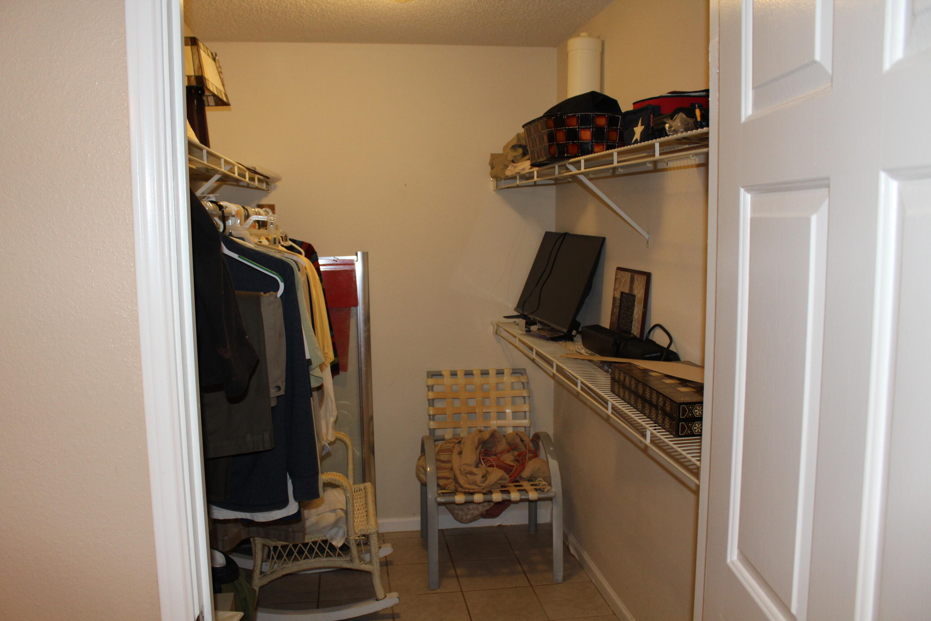 4080 Dancing Cloud Court, Unit 218 Destin, FL 32541 - Photo 19 of 28 a view of a hallway with storage and utility