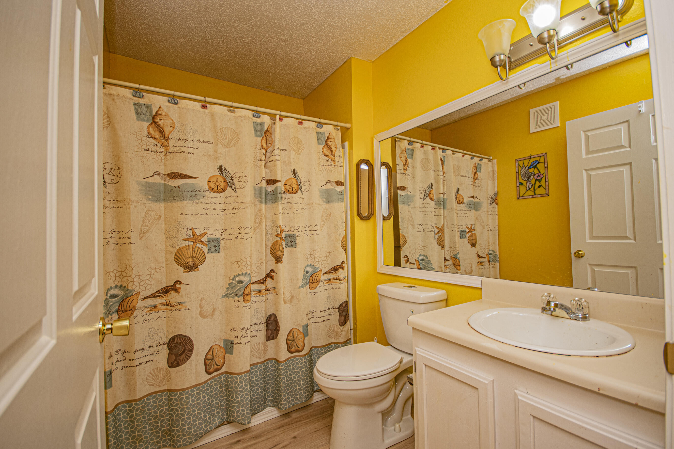 4080 Dancing Cloud Court, Unit 218 Destin, FL 32541 - Photo 20 of 28 a bathroom with a sink toilet and shower
