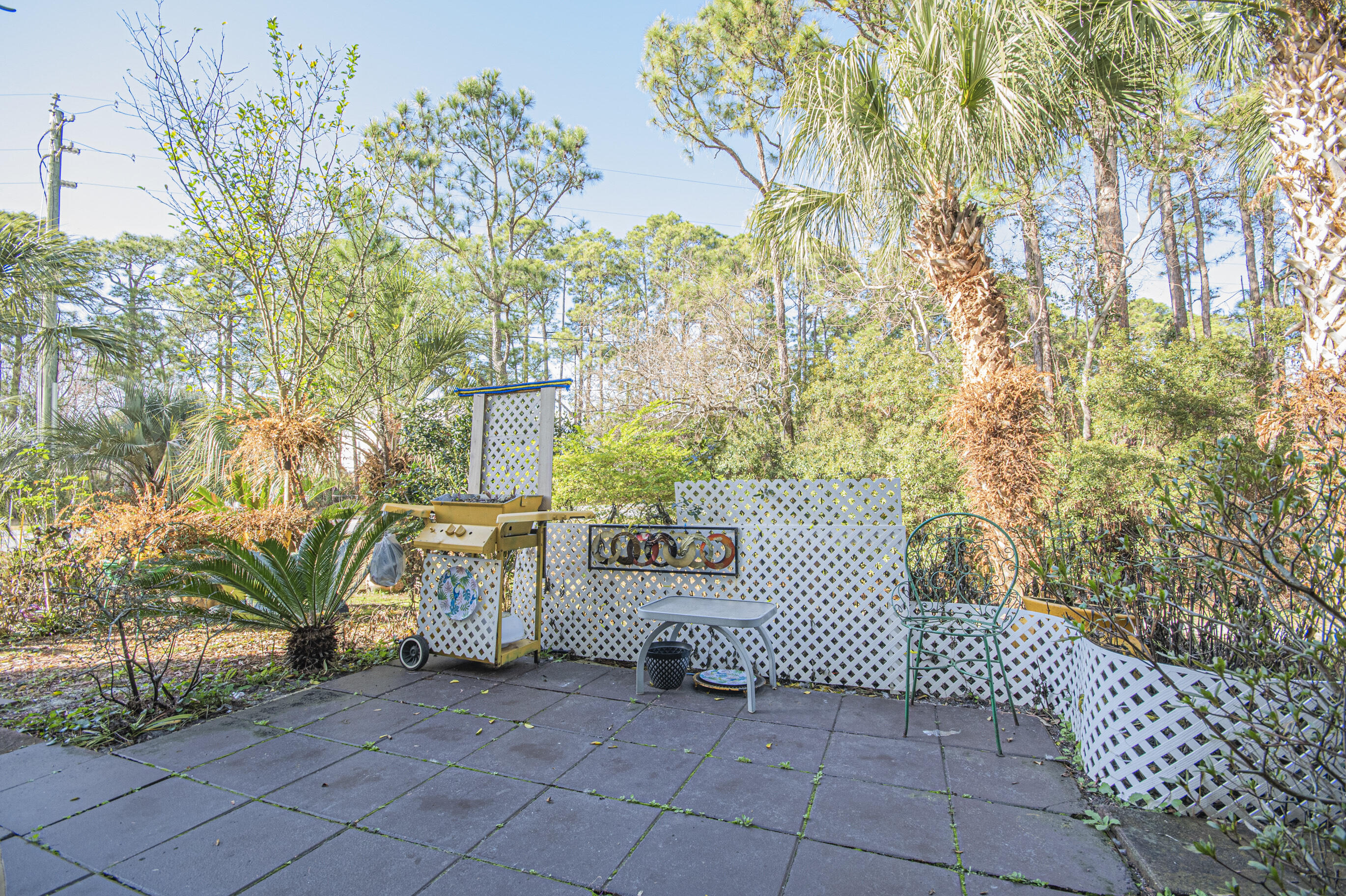 4080 Dancing Cloud Court, Unit 218 Destin, FL 32541 - Photo 24 of 28 a view of a entrance gate of the house and trees