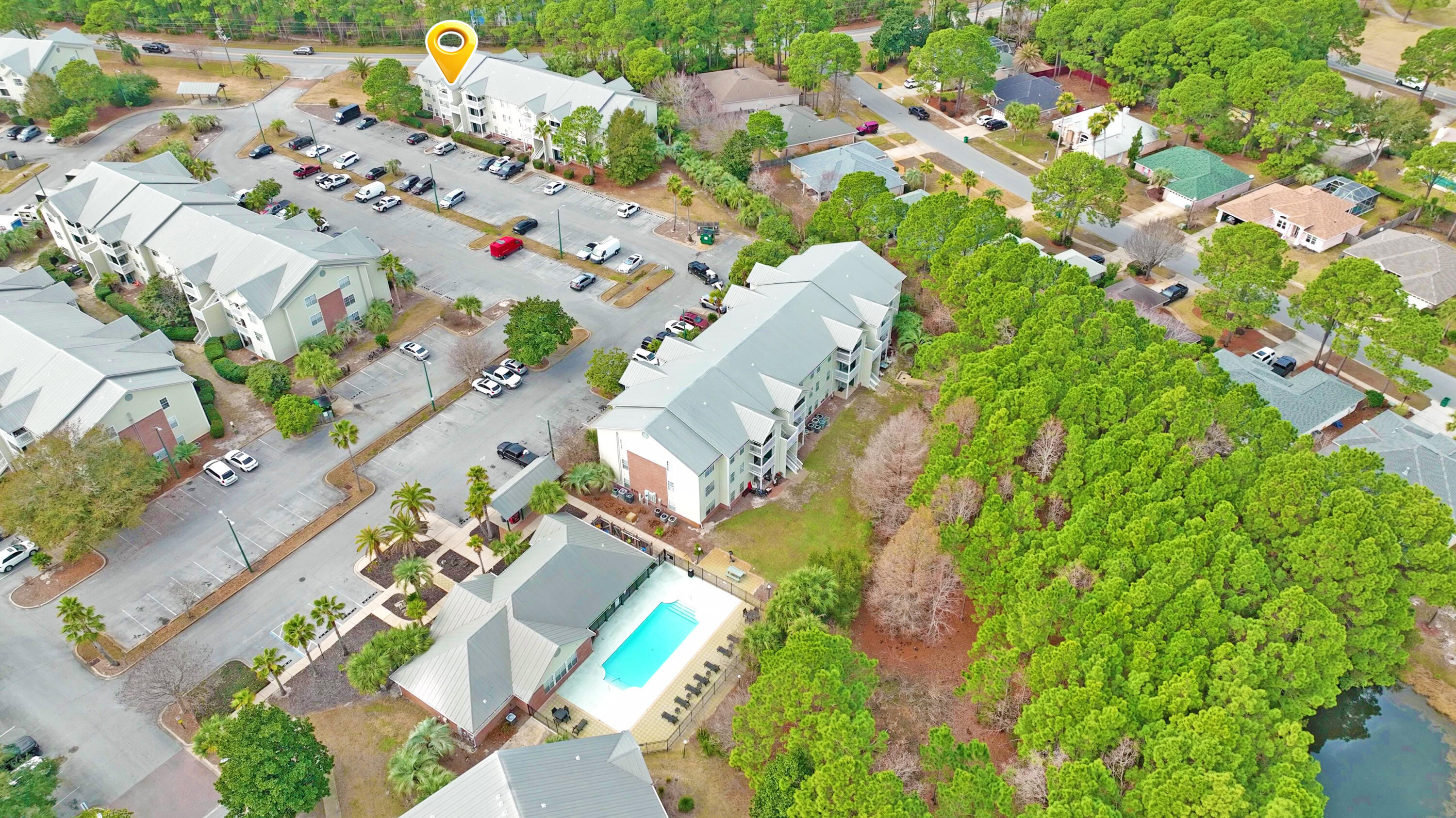 4080 Dancing Cloud Court, Unit 218 Destin, FL 32541 - Photo 6 of 28 an aerial view of a house with a yard and garden
