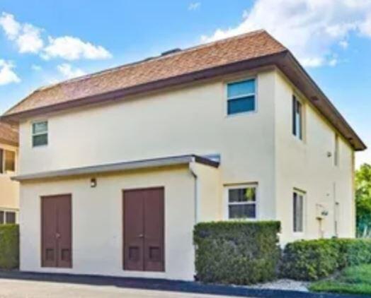 1155 Sandpiper Street, Unit F7 Naples, FL 34112 - Photo 1 of 1 a view of a house with a window