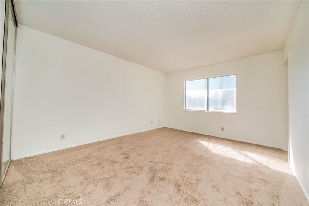 1385 West Wedgewood Street Rialto, CA 92376 - Photo 16 of 27 an empty room with windows