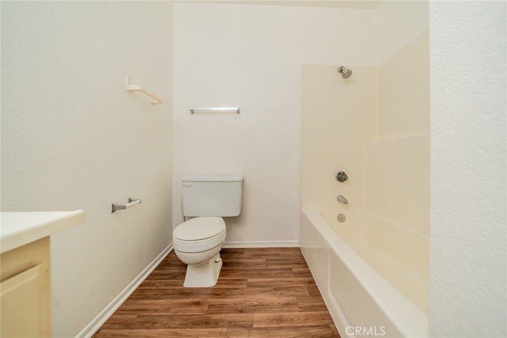 1385 West Wedgewood Street Rialto, CA 92376 - Photo 18 of 27 a bathroom with a toilet and a shower