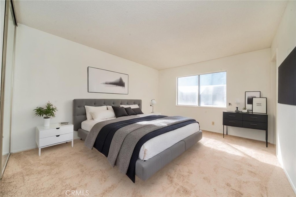 1385 West Wedgewood Street Rialto, CA 92376 - Photo 21 of 27 a spacious bedroom with a bed and window