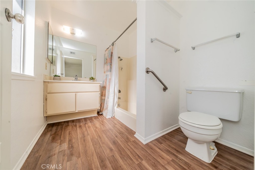 1385 West Wedgewood Street Rialto, CA 92376 - Photo 23 of 27 a bathroom with a sink and a toilet