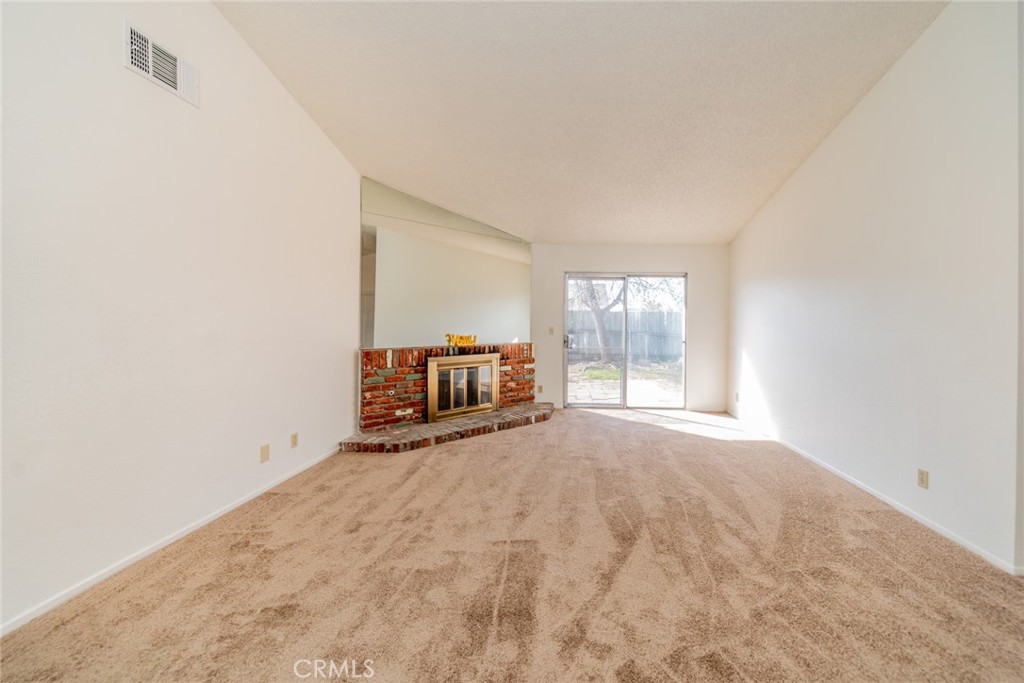 1385 West Wedgewood Street Rialto, CA 92376 - Photo 5 of 27 a view of a room with window and a kitchen counter top