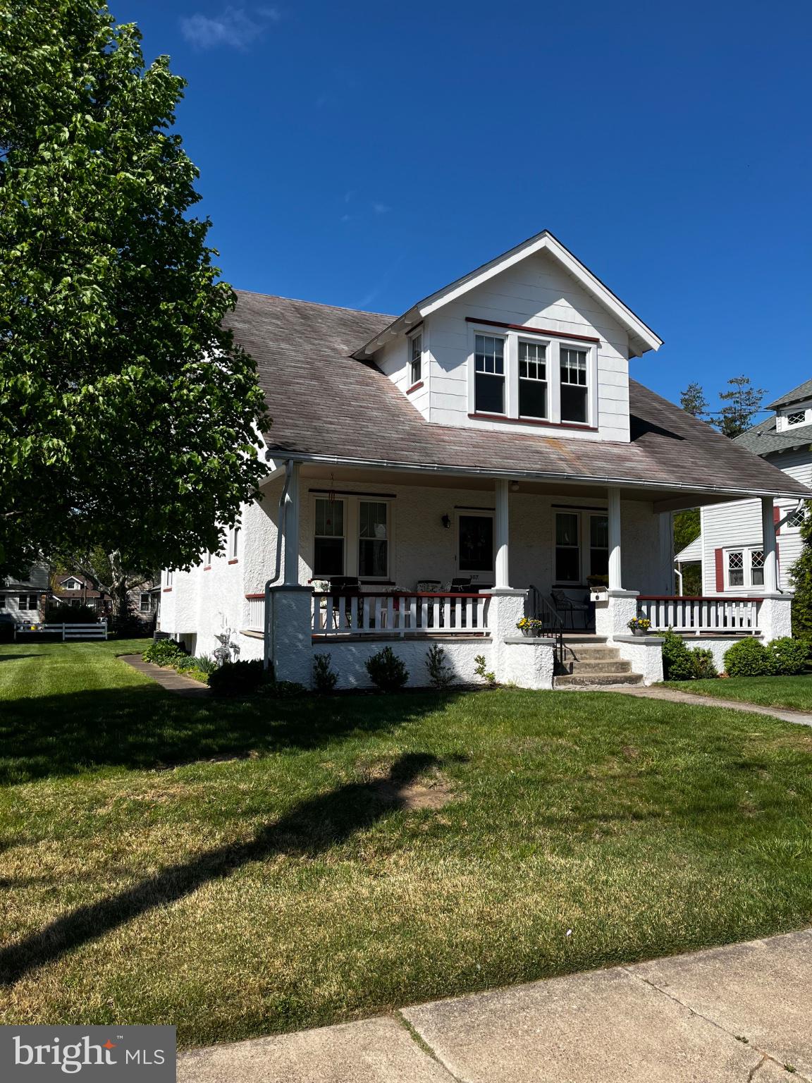 a view of a house with garden and porch