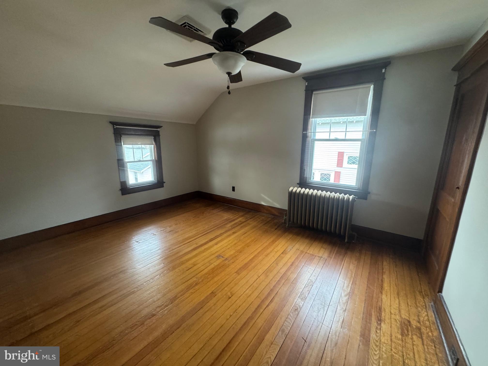 307 Edgewood Avenue Delanco, NJ 08075 - Photo 11 of 16 a view of an empty room with wooden floor and a window