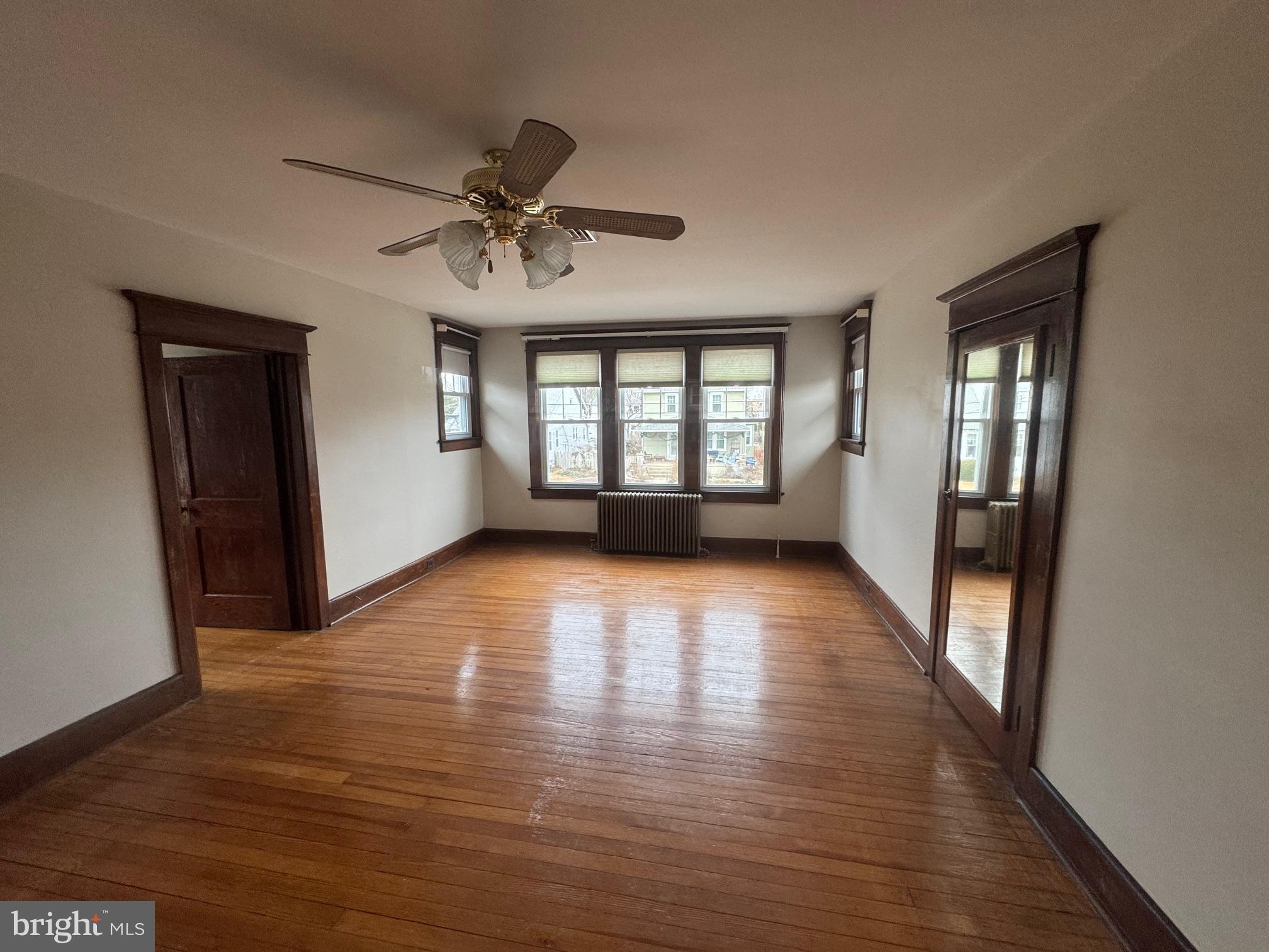 307 Edgewood Avenue Delanco, NJ 08075 - Photo 9 of 16 a view of empty room with wooden floor and fan