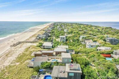 an aerial view of residential building with an ocean view
