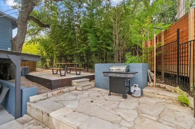 a view of a backyard with sitting area