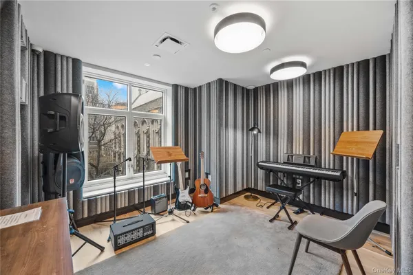 a bedroom with furniture and a window