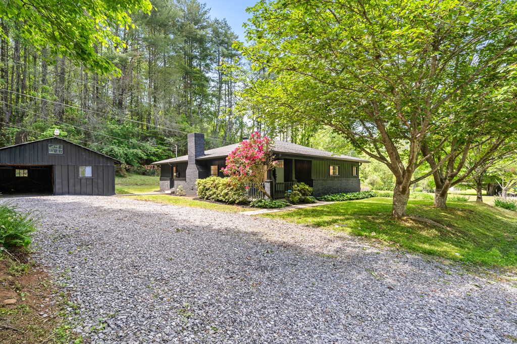 514 Ash Loop Road Blue Ridge, GA 30513 - Photo 2 of 24 a front view of a house with garden