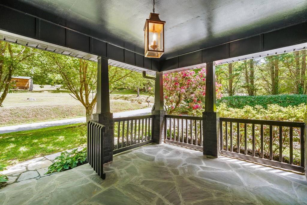 514 Ash Loop Road Blue Ridge, GA 30513 - Photo 6 of 24 a view of a porch with wooden floor and outdoor space