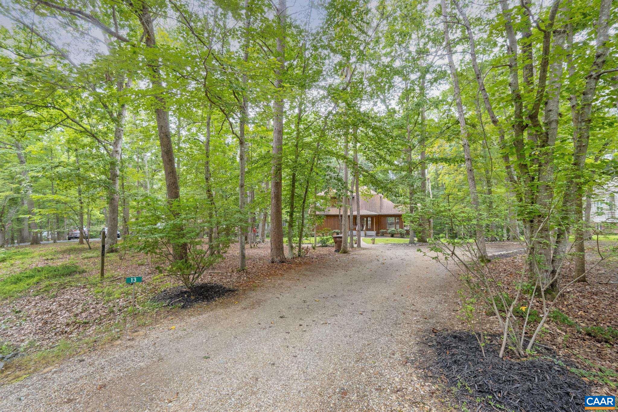 13 Axle Tree Road Palmyra, VA 22963 - Photo 10 of 71 a view of a house with large trees and plants