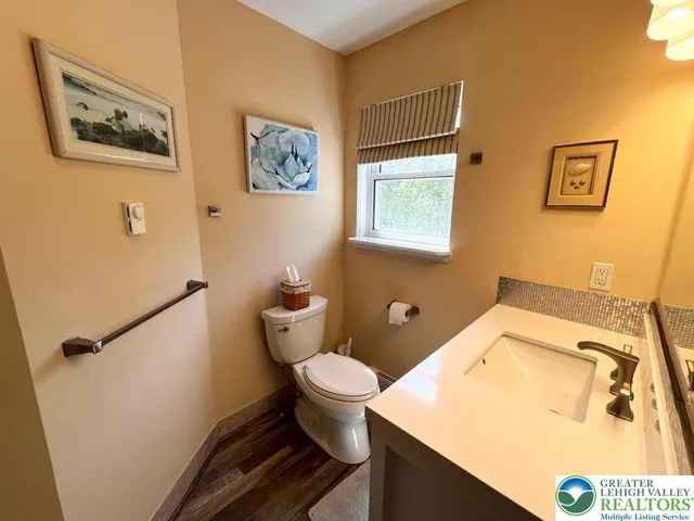 a bathroom with a toilet and a sink