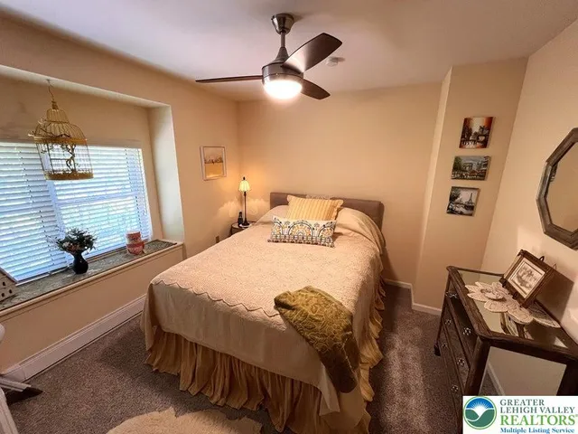 a bedroom with a bed and a desk