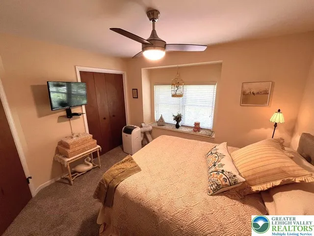 a bed room with a bed and a lamp