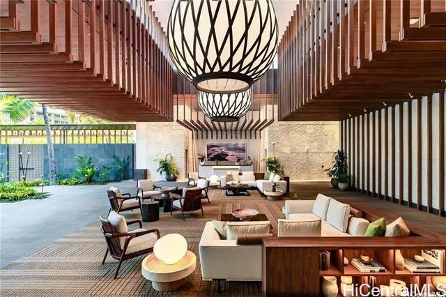 a living room with furniture a window and chairs