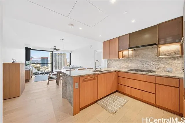 a kitchen with stainless steel appliances granite countertop a sink and cabinets