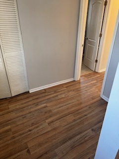 6418-20 South Stewart Avenue Chicago, IL 60621 - Photo 13 of 41 a view of an empty room with wooden floor and a window