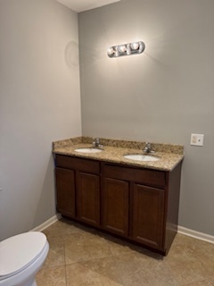 6418-20 South Stewart Avenue Chicago, IL 60621 - Photo 17 of 41 a bathroom with a sink a toilet and mirror