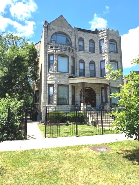 6418-20 South Stewart Avenue Chicago, IL 60621 - Photo 2 of 41 a view of a brick house with a swimming pool