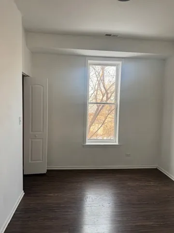 a bathroom with a granite countertop sink a mirror bathtub and shower