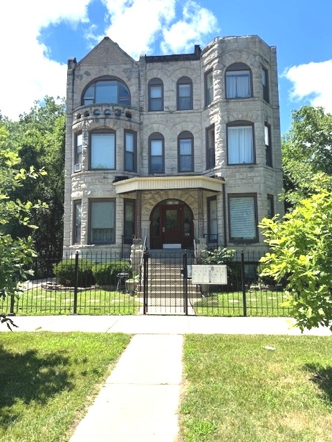 6418-20 South Stewart Avenue Chicago, IL 60621 - Photo 3 of 41 a front view of a house with a yard