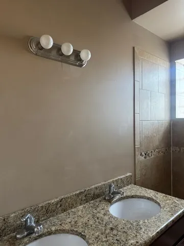 a white toilet sitting next to a sink