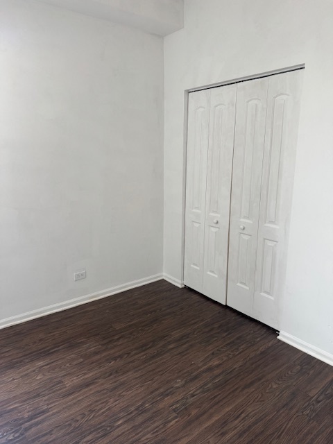 6418-20 South Stewart Avenue Chicago, IL 60621 - Photo 36 of 41 a view of an empty room with wooden floor