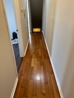 6418-20 South Stewart Avenue Chicago, IL 60621 - Photo 6 of 41 a view of a hallway with wooden floor and stairs