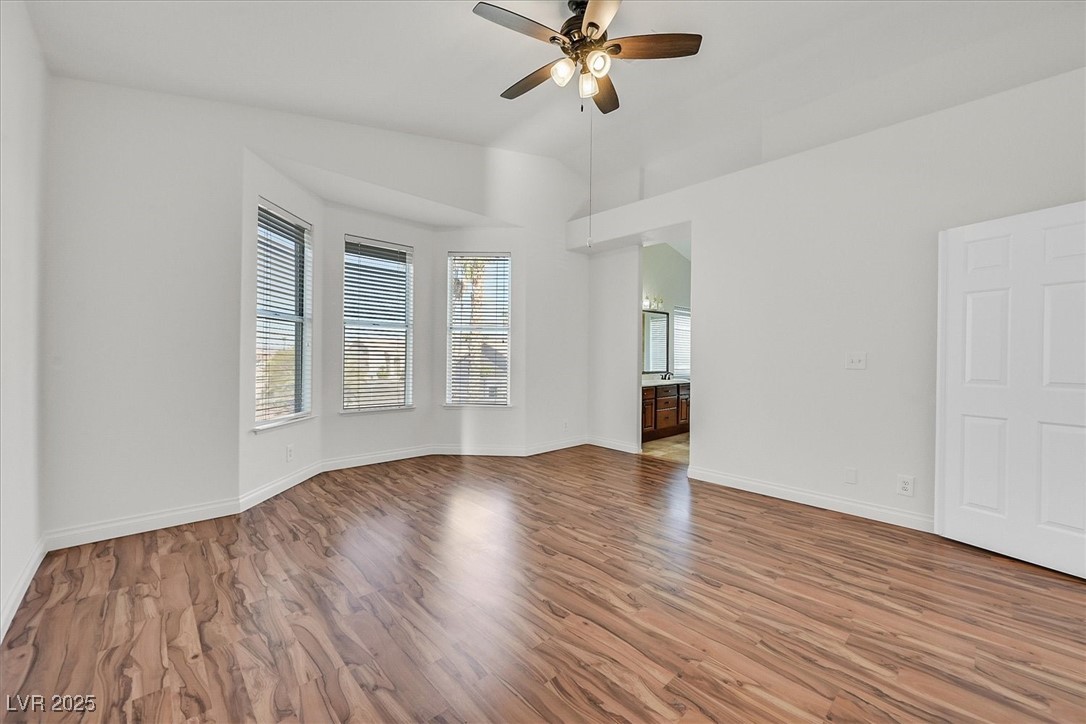 234 Highgate Street Henderson, NV 89074 - Photo 12 of 22 Spare room featuring a ceiling fan and wood finished floors