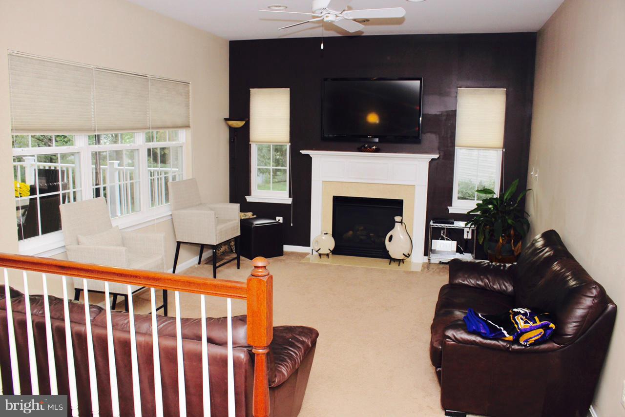 1322 North Rolling Road Baltimore, MD 21228 - Photo 12 of 30 a living room with furniture and a fireplace
