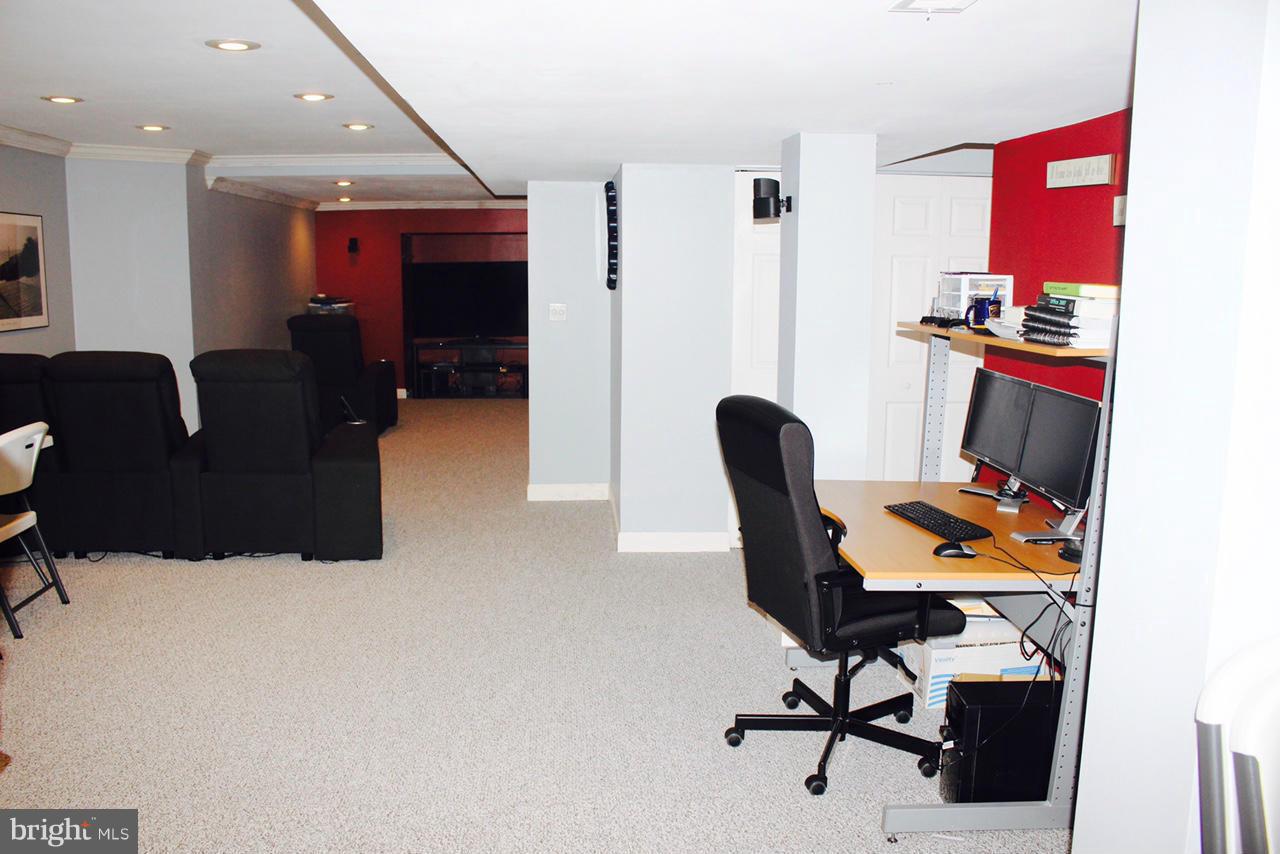 1322 North Rolling Road Baltimore, MD 21228 - Photo 18 of 30 a work room with furniture and gym equipment