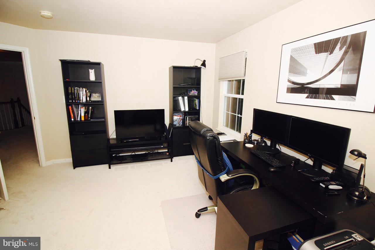 1322 North Rolling Road Baltimore, MD 21228 - Photo 25 of 30 a living room with furniture and a flat screen tv