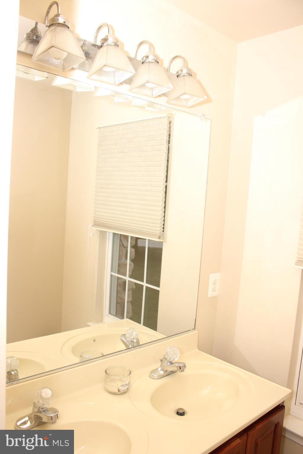 1322 North Rolling Road Baltimore, MD 21228 - Photo 29 of 30 a view of a bedroom with a bed