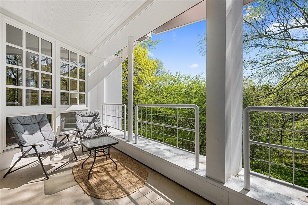 63 Garden Road, Unit C5 Wellesley, MA 02481 - Photo 6 of 30 a living room with furniture and a large window