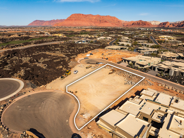 0 St. George, UT 84770 - Photo 12 of 22 Aerial view of residential area featuring a mountainous background and a desert landscape