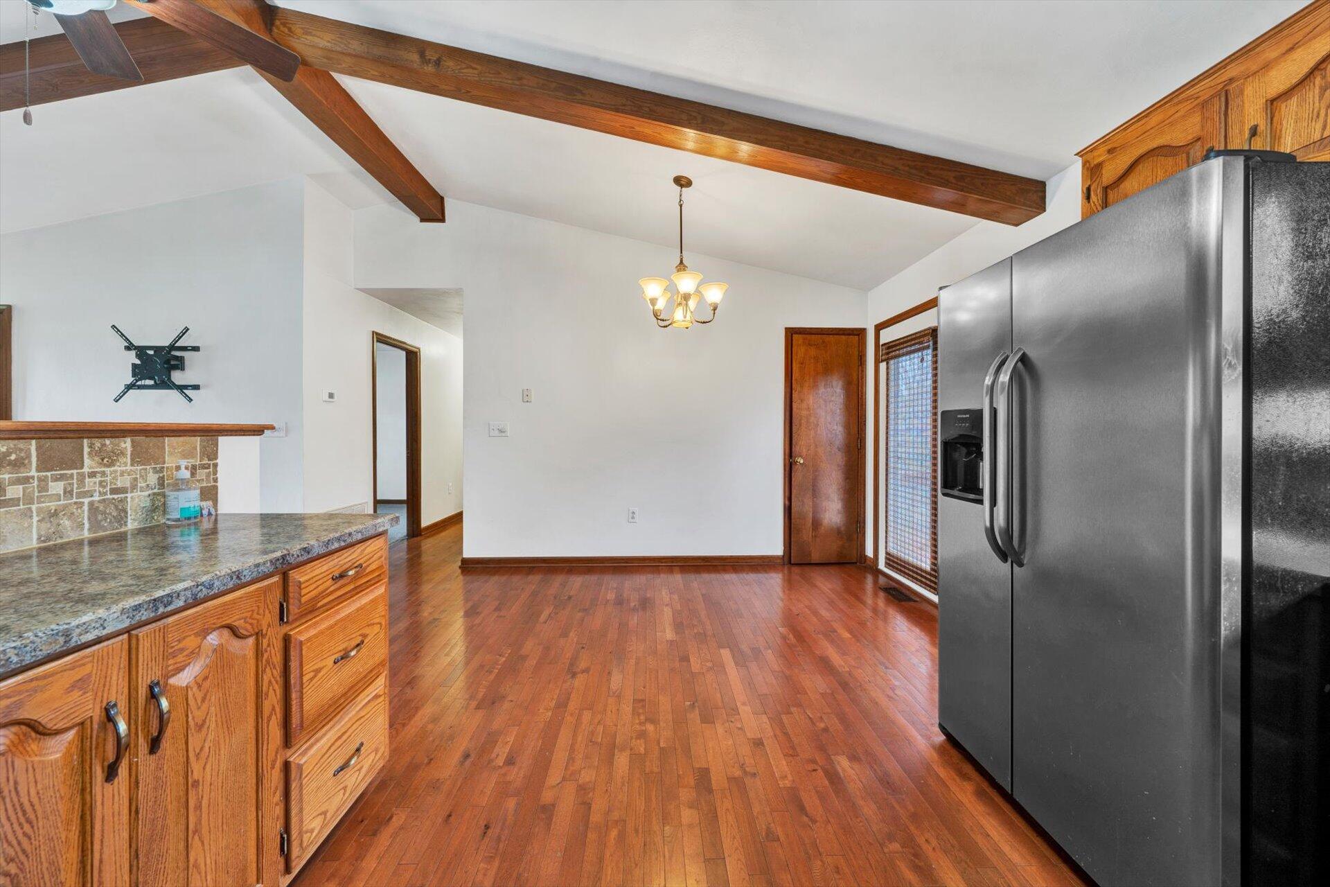 2921 Quarles Road Thaxton, VA 24174 - Photo 12 of 30 a kitchen with stainless steel appliances granite countertop a refrigerator a stove and a wooden floors