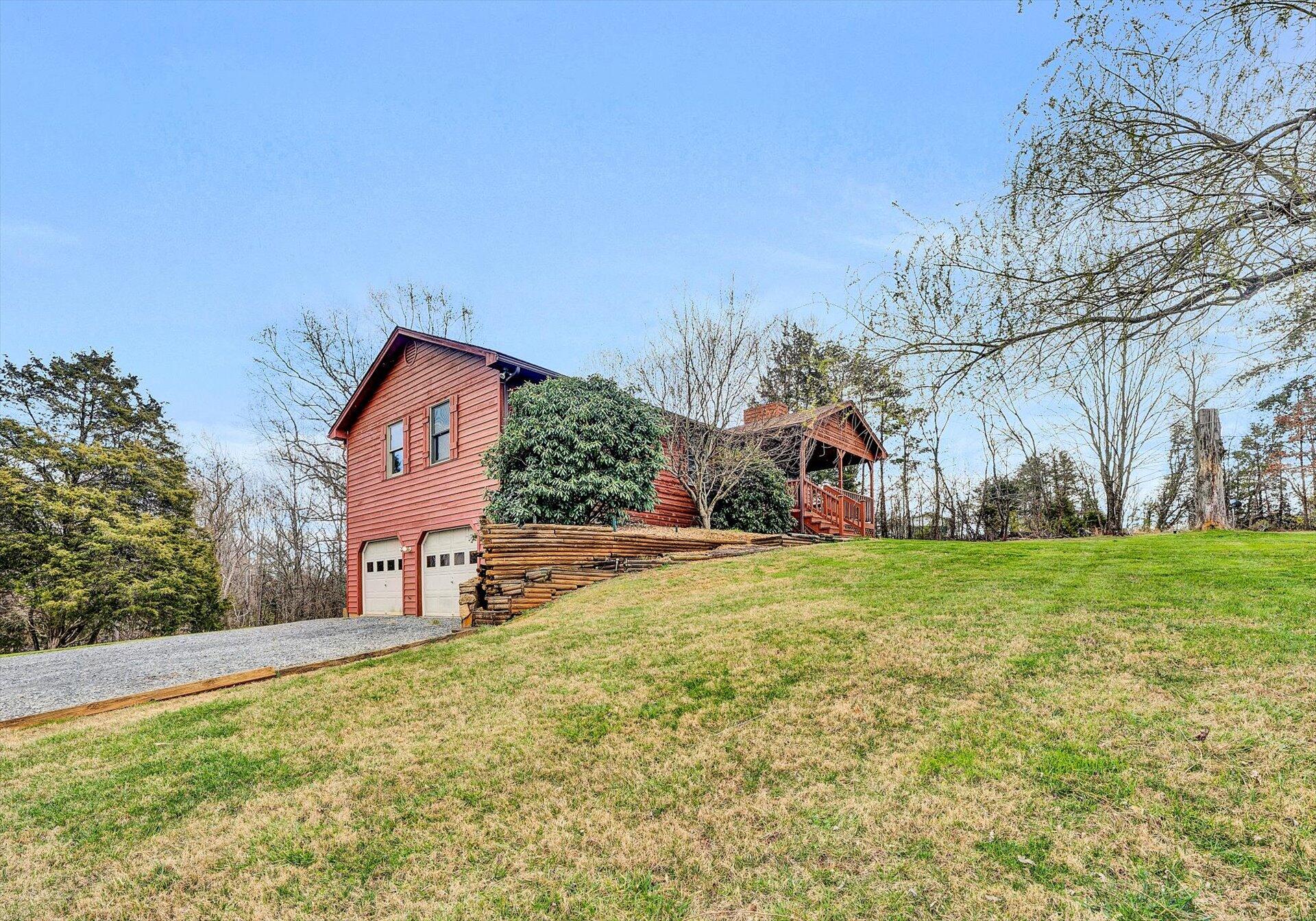 2921 Quarles Road Thaxton, VA 24174 - Photo 2 of 30 a front view of a house with garden