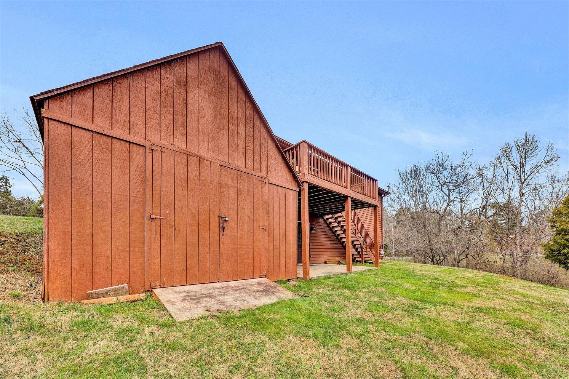 2921 Quarles Road Thaxton, VA 24174 - Photo 27 of 30 a backyard of a house with lots of green space and wooden fence