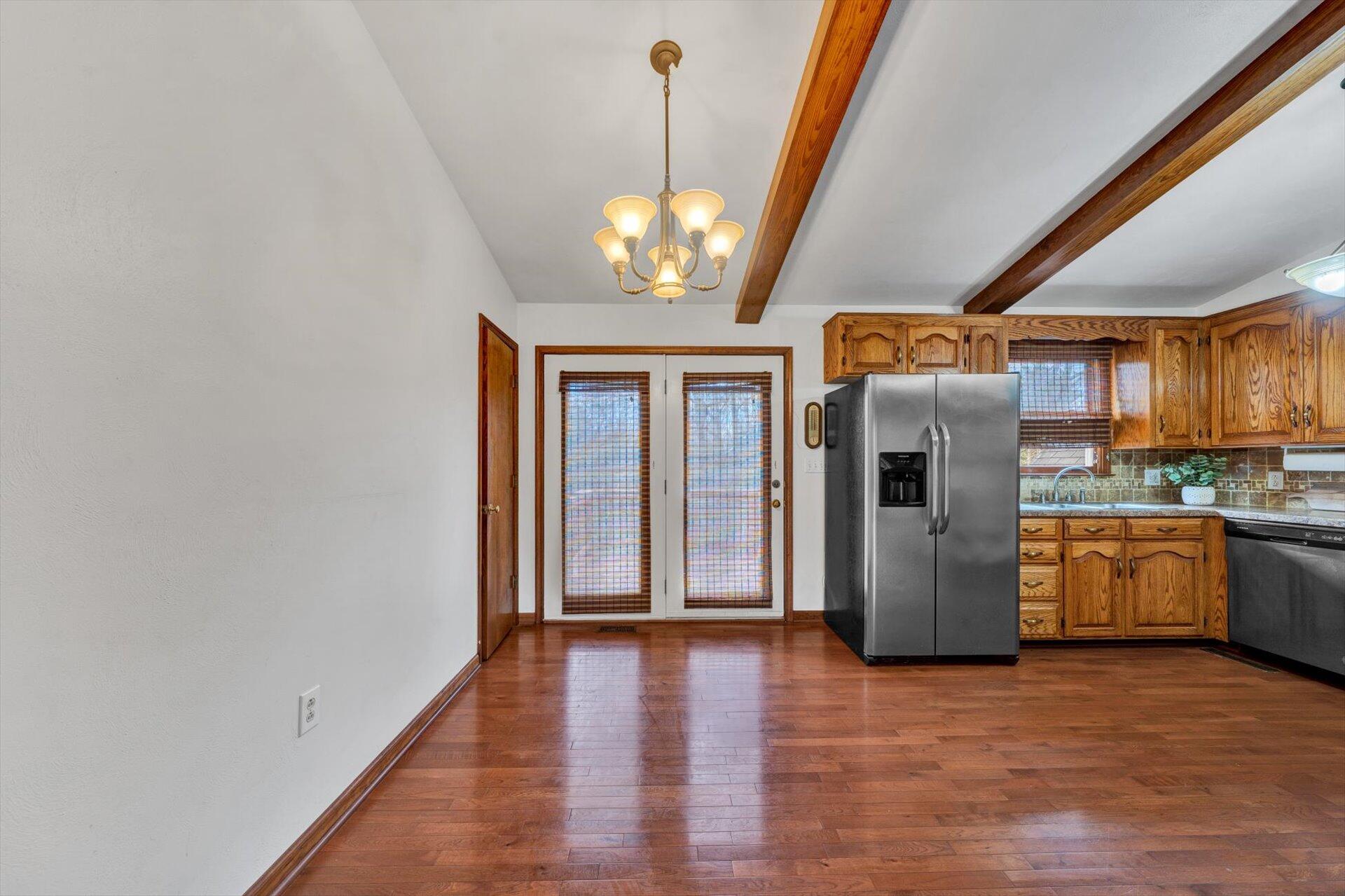 2921 Quarles Road Thaxton, VA 24174 - Photo 9 of 30 a kitchen with refrigerator and microwave