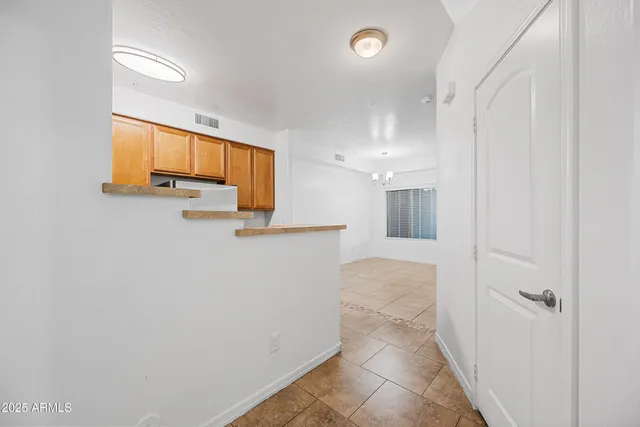 a view of a hallway with seating area