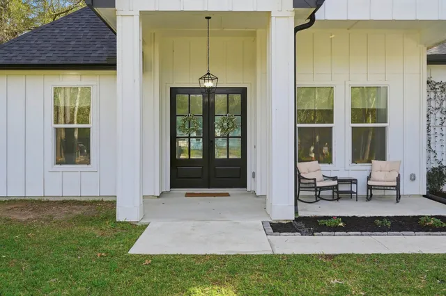 a backyard of a house with outdoor seating